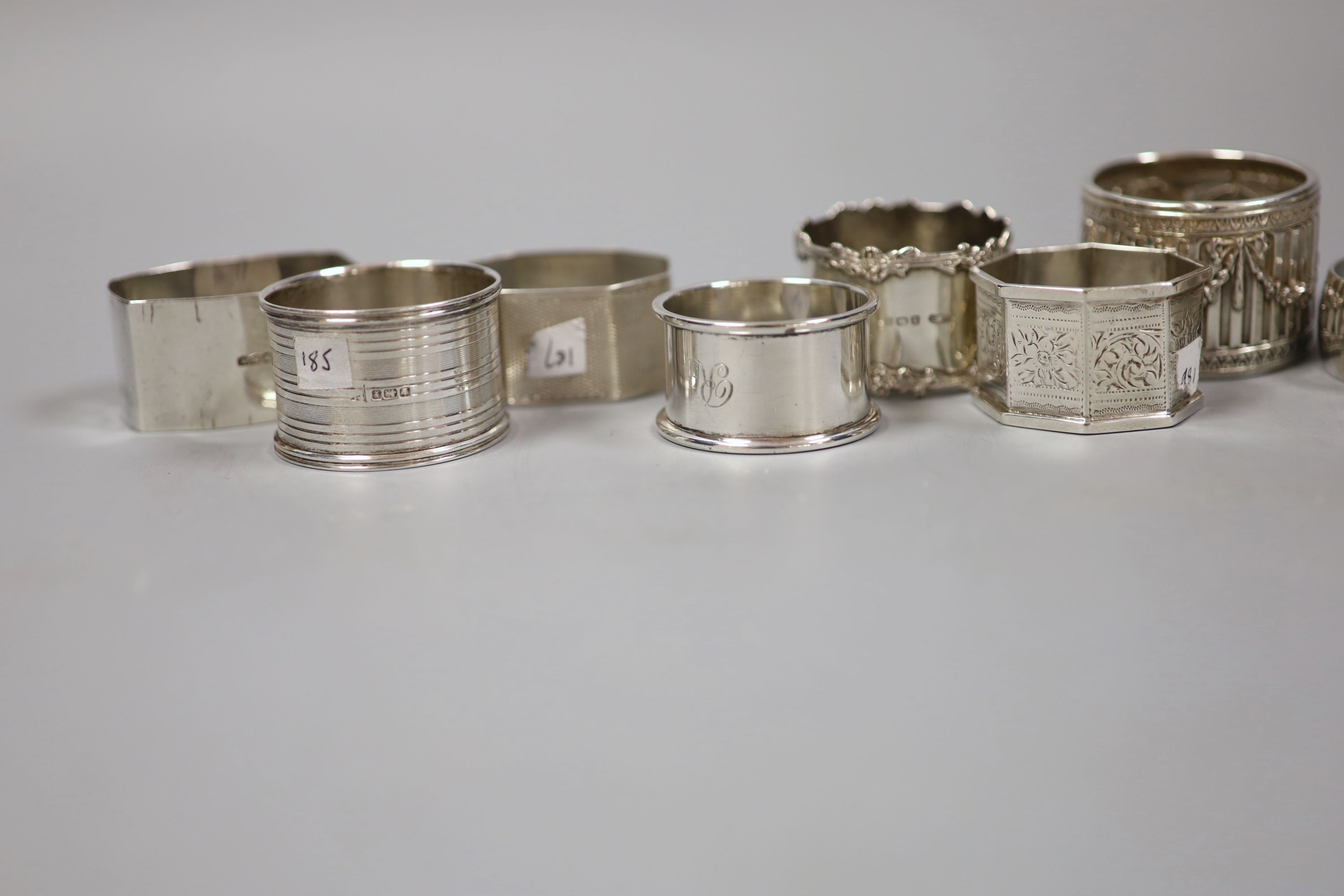 Nine assorted silver napkin rings, 7oz.